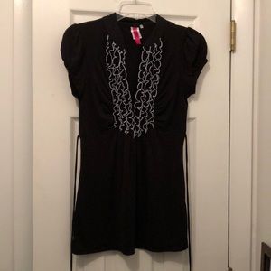 Black shirt with ruffles.